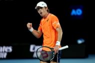 Alex de Minaur celebrates a point against Milos Raonic.